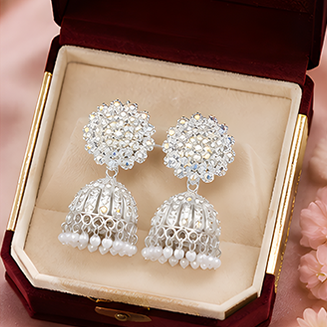Radiant Silver-Plated Sparkling Crystal Floral Studded Jhumka Earrings with Pearl Hangings