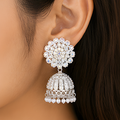 Radiant Silver-Plated Sparkling Crystal Floral Studded Jhumka Earrings with Pearl Hangings