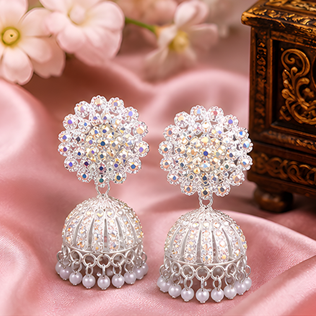 Radiant Silver-Plated Sparkling Crystal Floral Studded Jhumka Earrings with Pearl Hangings